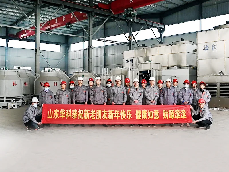 Huake team in front of cooling towers in the workshop