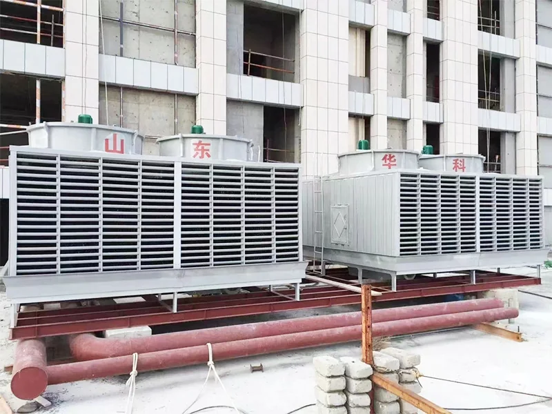 Open cooling towers with piping on a construction site