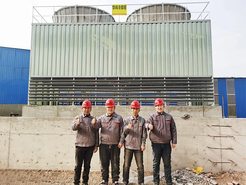 Square cooling tower on a concrete base with Huake engineers
